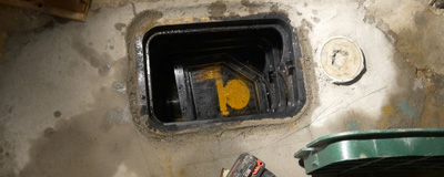 Technician installing a backwater valve