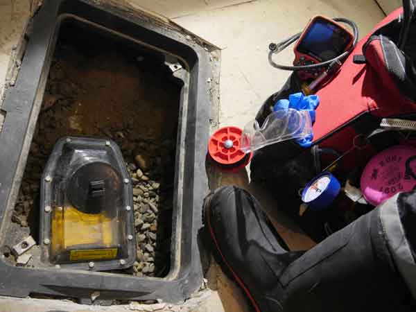 Homeowner maintaining safety systems